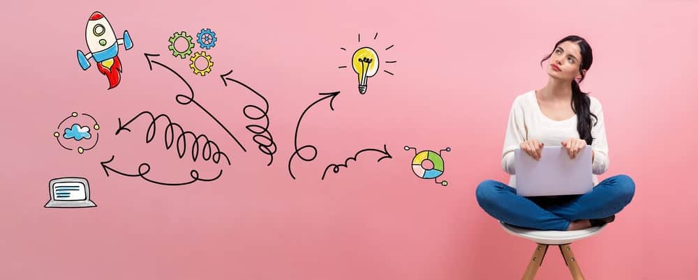 woman dreaming at computer - business coach