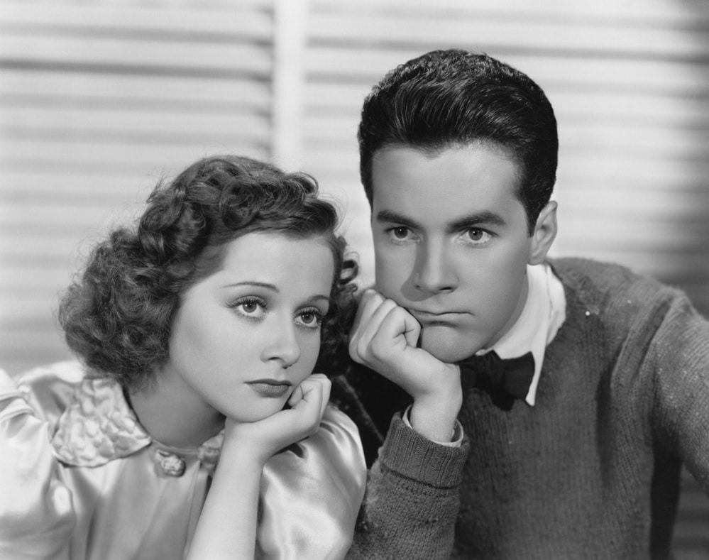 Black and white image of young couple showing Boredom at Work.
